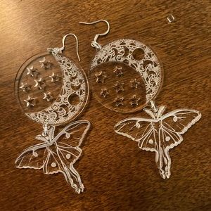Moth earrings with moon and stars made of clear acrylic